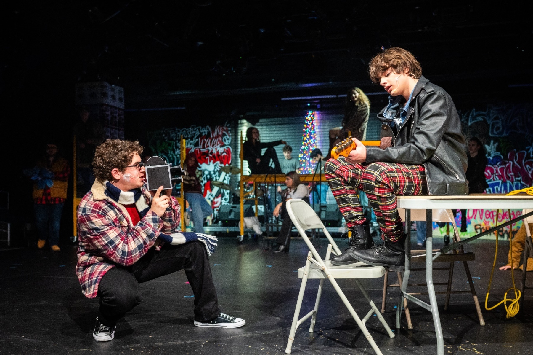 3 students on stage